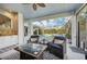 Comfortable outdoor seating area with fireplace and pool view at 13136 Peregrin Cir, Bradenton, FL 34212