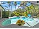 Beautiful screened pool with a basketball hoop and tropical landscaping at 13136 Peregrin Cir, Bradenton, FL 34212