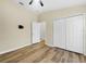 Inviting bedroom with ceiling fan, closet, wood floor, and neutral walls, offering a comfortable retreat at 15452 Long Cypress Dr, Ruskin, FL 33573