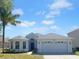 Charming single-Gathering home featuring a well-manicured lawn and a two-car garage at 15452 Long Cypress Dr, Ruskin, FL 33573