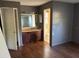 Main bathroom with vanity, and an adjacent toilet behind the doorway at 2918 E Waters Ave, Tampa, FL 33604