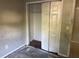 Bedroom closet with bi-fold doors and neutral carpeting at 2918 E Waters Ave, Tampa, FL 33604