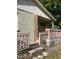 Charming home front entrance featuring decorative stone pillar and covered porch at 2918 E Waters Ave, Tampa, FL 33604