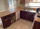 Kitchen with laminate countertops, dishwasher and double basin stainless steel sink at 2918 E Waters Ave, Tampa, FL 33604