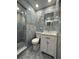 Stylish bathroom features a tiled shower and modern vanity at 3747 Floramar Ter, New Port Richey, FL 34652