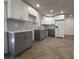 Updated kitchen with stainless steel appliances, modern backsplash and granite countertops at 3747 Floramar Ter, New Port Richey, FL 34652