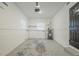 This is a garage with lots of empty space with utility hookups and a single window at 3645 6Th S St, St Petersburg, FL 33705