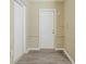 This is a hallway with neutral walls and updated flooring at 3645 6Th S St, St Petersburg, FL 33705