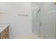 Modern bathroom features a glass shower with stone floor, towel bar and a wood vanity at 7338 N Ficus Tree, Punta Gorda, FL 33955