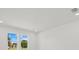 This bedroom has recessed lighting, white walls, baseboards and windows with outdoor views at 7338 N Ficus Tree, Punta Gorda, FL 33955