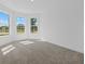 Bright bedroom with large windows, neutral carpet, and white walls at 7338 N Ficus Tree, Punta Gorda, FL 33955