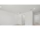 Neutral bedroom features recessed lights, white walls, carpet and a doorway leading to another room at 7338 N Ficus Tree, Punta Gorda, FL 33955