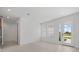 Bright living space featuring tiled floors, large windows, and glass doors that provide ample natural light at 7338 N Ficus Tree, Punta Gorda, FL 33955