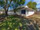 Backyard view featuring a pool and large shade tree at 8080 Spanish Oak Dr, Spring Hill, FL 34606