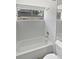 Clean bathroom with white tiled shower and sink at 8080 Spanish Oak Dr, Spring Hill, FL 34606
