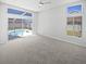 Bedroom with large windows overlooking the pool area at 8080 Spanish Oak Dr, Spring Hill, FL 34606