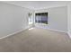 Bedroom featuring neutral carpet and windows providing plenty of light at 8080 Spanish Oak Dr, Spring Hill, FL 34606