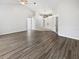 Spacious living room with high ceilings and luxury vinyl plank flooring provides an inviting space for gatherings at 8080 Spanish Oak Dr, Spring Hill, FL 34606