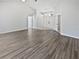 Open-concept living room with hardwood floors and a bright, airy atmosphere at 8080 Spanish Oak Dr, Spring Hill, FL 34606