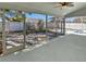 Relaxing screened-in patio with pool access and fan offers seamless indoor-outdoor living at 8080 Spanish Oak Dr, Spring Hill, FL 34606