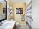 Clean bathroom featuring a sink, toilet, and shower with modern fixtures at 11805 Castine St, New Port Richey, FL 34654