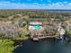 Aerial view of community amenities including pool, lake, playground, and dock at 11805 Castine St, New Port Richey, FL 34654