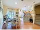 Bright dining area with a table, chairs, and sliding glass door leading to the outdoors at 11805 Castine St, New Port Richey, FL 34654