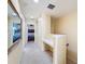 Bright hallway with built-in desk and a view into the main bedroom at 11805 Castine St, New Port Richey, FL 34654