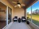 An outdoor lanai with comfortable seating and serene backyard views provides a relaxing retreat at 11805 Castine St, New Port Richey, FL 34654