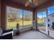 A screened lanai with views of the backyard and a ceiling fan provides a great place to relax at 11805 Castine St, New Port Richey, FL 34654