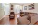 Comfortable living room with hardwood floors, a plush couch, and ample seating at 11805 Castine St, New Port Richey, FL 34654