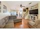 Open-concept living room with hardwood floors and easy access to kitchen and dining area at 11805 Castine St, New Port Richey, FL 34654