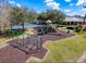 Aerial view of the community playground with swings, slides, and a soft landing at 11805 Castine St, New Port Richey, FL 34654