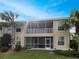 Rear exterior of a home featuring screened in porch and balcony at 1181 Burgos Dr # 406, Sarasota, FL 34238