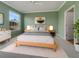 Relaxing main bedroom suite with a large window and a neutral color palette at 1181 Burgos Dr # 406, Sarasota, FL 34238