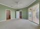 Large bedroom with plush carpeting, neutral paint, and sliding doors to the outdoor area at 1181 Burgos Dr # 406, Sarasota, FL 34238
