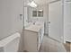 Bathroom featuring a vanity with double sinks, tile floors, and modern lighting at 612 Bird Bay S Dr # 113, Venice, FL 34285