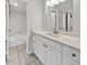 Bathroom featuring a vanity with sink, tile floors, modern lighting and bathtub at 612 Bird Bay S Dr # 113, Venice, FL 34285