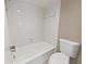 Bright bathroom featuring a shower-tub combo, and a clean white toilet at 612 Bird Bay S Dr # 113, Venice, FL 34285