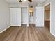 View of bedroom, bathroom and closet with wood floors at 612 Bird Bay S Dr # 113, Venice, FL 34285