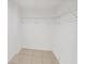 White closet featuring tile floors and wire shelving at 612 Bird Bay S Dr # 113, Venice, FL 34285
