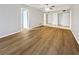 View of an empty main bedroom with a ceiling fan and multiple doors at 612 Bird Bay S Dr # 113, Venice, FL 34285