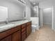 Bathroom featuring tile floors, granite counter tops, and a walk-in shower at 8110 Enclave Way # 101, Sarasota, FL 34243