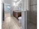 Bathroom featuring tile floors, a double vanity and an enclosed walk-in shower at 8110 Enclave Way # 101, Sarasota, FL 34243