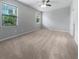 Bedroom with windows and carpet at 8110 Enclave Way # 101, Sarasota, FL 34243