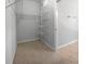 Walk-in closet offering shelving and tile flooring at 8110 Enclave Way # 101, Sarasota, FL 34243