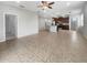 Open-concept living space featuring tile floors, recessed lighting, and a stylish kitchen island at 8110 Enclave Way # 101, Sarasota, FL 34243