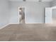 This main bedroom has neutral carpet and ensuite bathroom at 8110 Enclave Way # 101, Sarasota, FL 34243