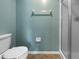 The bathroom includes a toilet, towel rack, toilet paper holder, and walk-in shower at 6507 Stone River Rd # 310, Bradenton, FL 34203