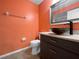 The bathroom features a dark-stained vanity with a vessel sink and neutral wall color at 6507 Stone River Rd # 310, Bradenton, FL 34203